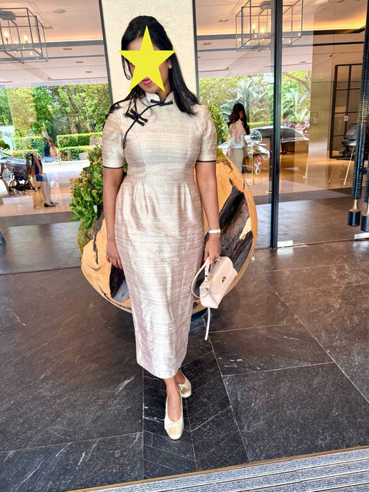 Why are fewer women choosing to wear the Cheongsam in Singapore?