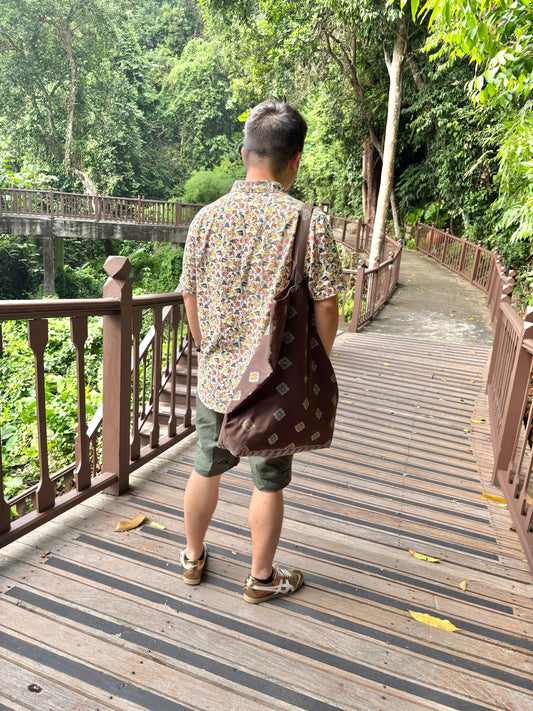 A dark brown Songket fabric bag, handcrafted in Singapore.