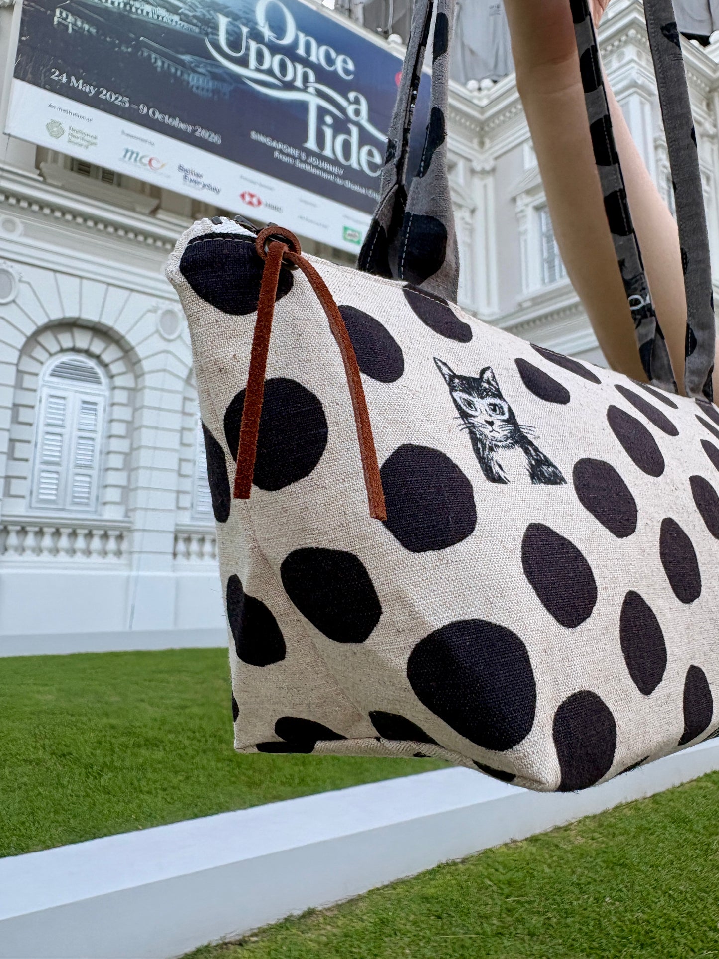 Polka dot handbag made from Japanese canvas featuring a cat print, handmade in Singapore. Finished with a YKK zipper and leather zipper puller.
