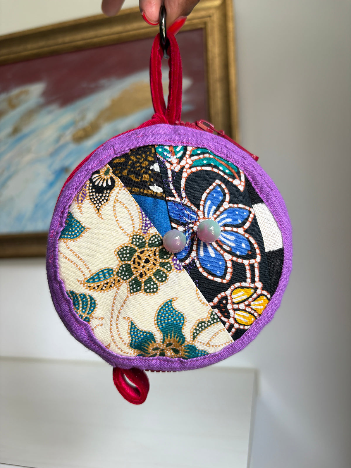 Round bag charm handmade in Singapore from a mix of Batik and Japanese fabrics. Batik bag charm. Batik bag accessory.