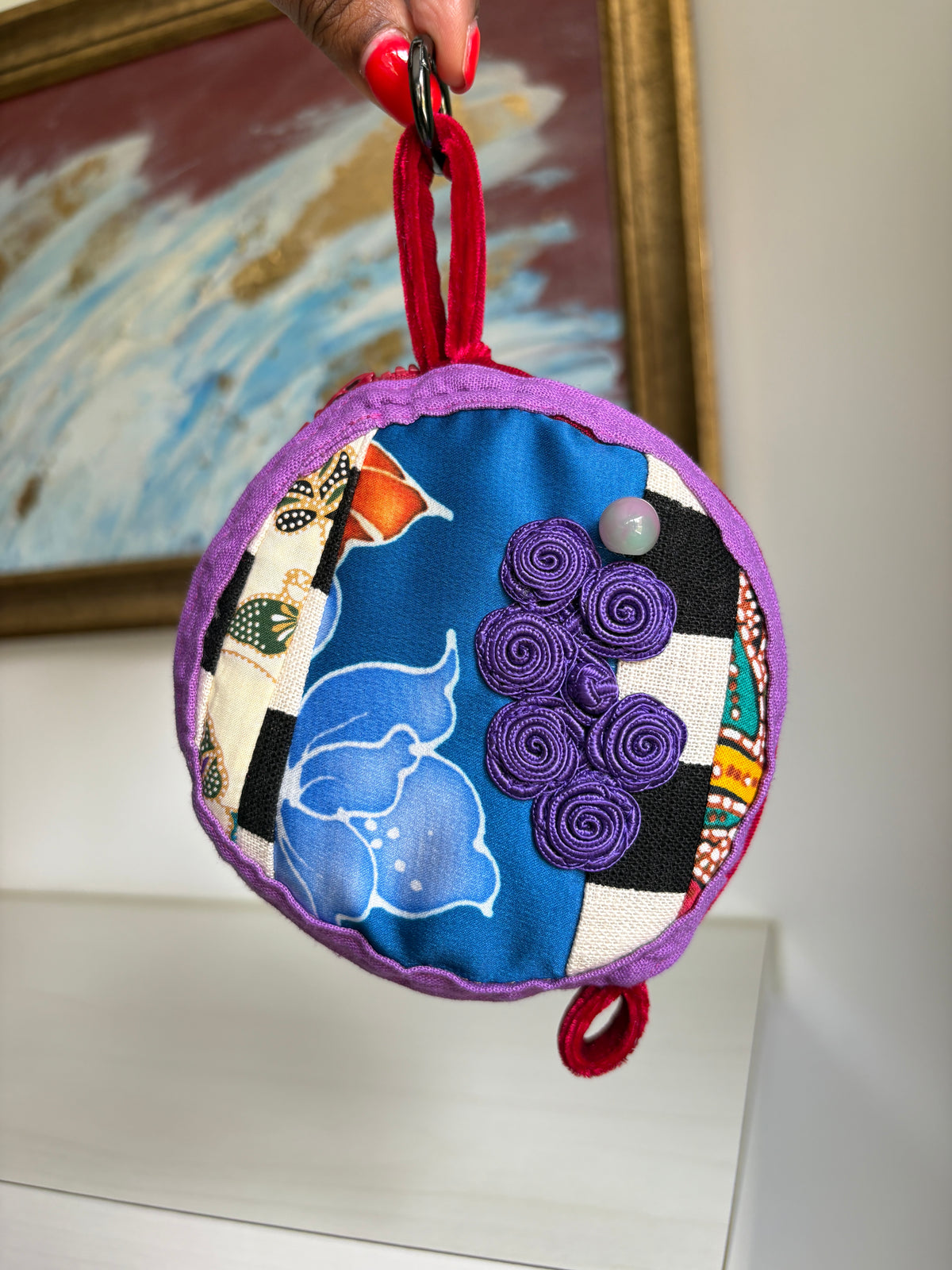 Round bag charm handmade in Singapore from a mix of Batik and Japanese fabrics. Batik bag charm. Batik bag accessory.