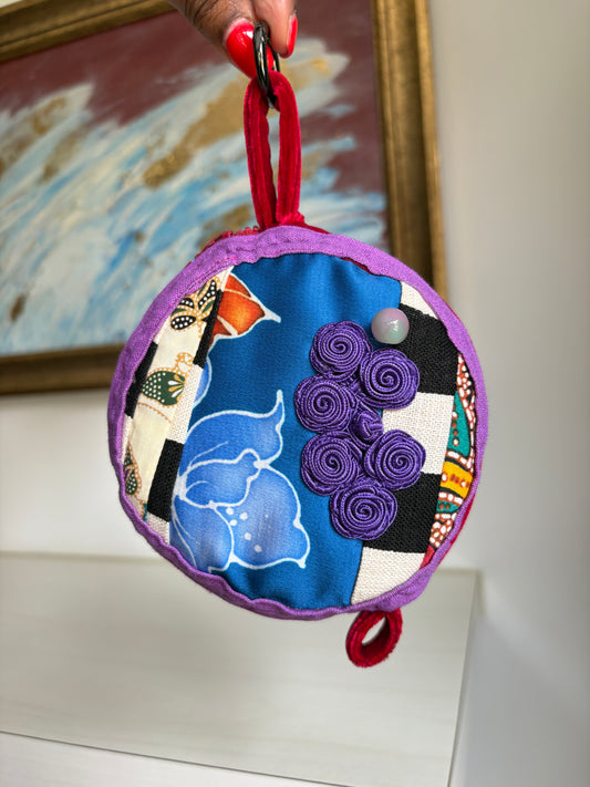 Round bag charm handmade in Singapore from a mix of Batik and Japanese fabrics. Batik bag charm. Batik bag accessory.