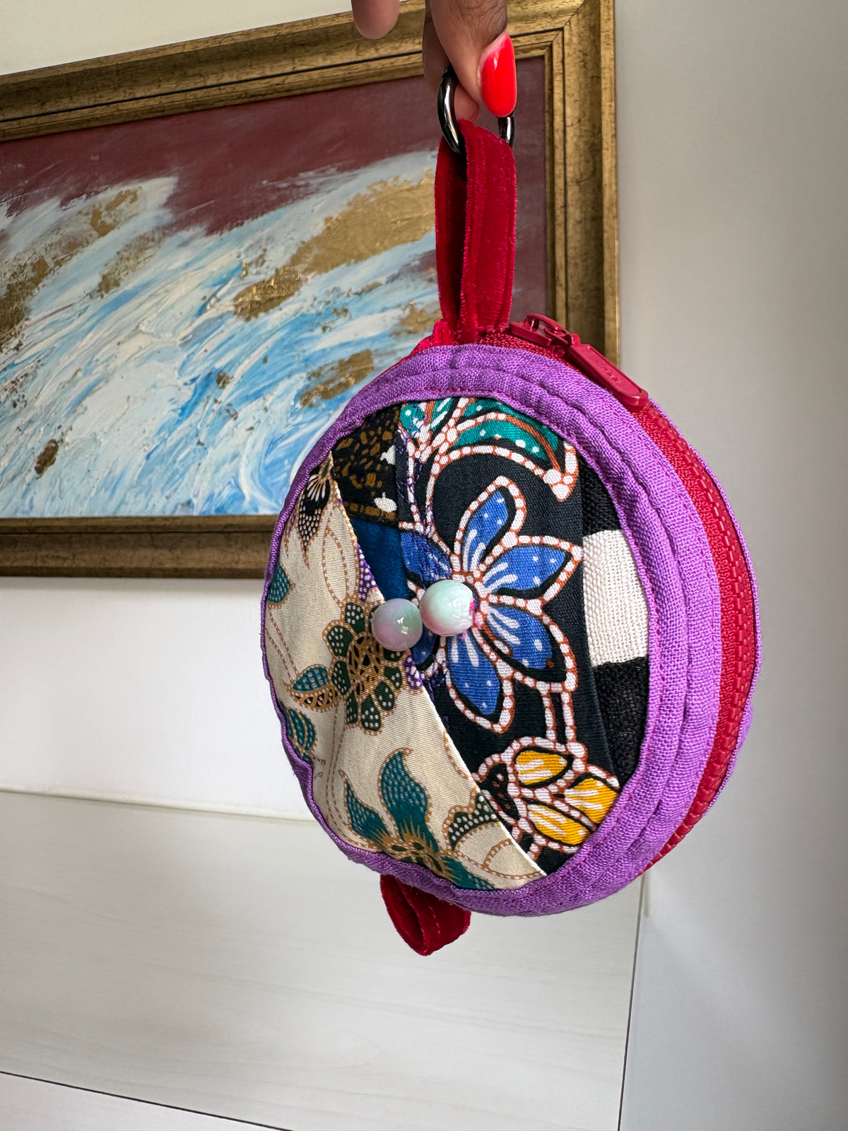 Round bag charm handmade in Singapore from a mix of Batik and Japanese fabrics. Batik bag charm. Batik bag accessory.