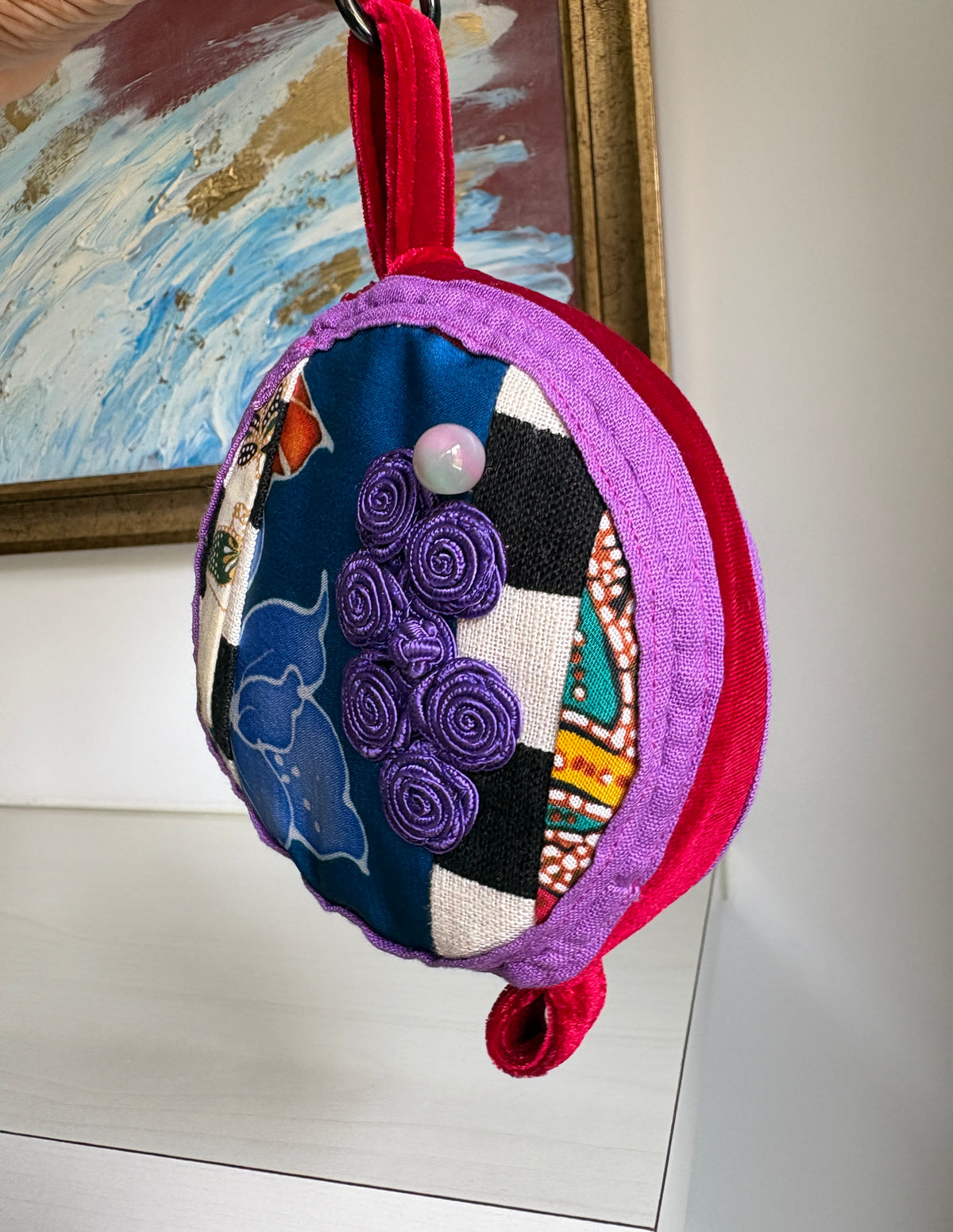 Round bag charm handmade in Singapore from a mix of Batik and Japanese fabrics. Batik bag charm. Batik bag accessory.