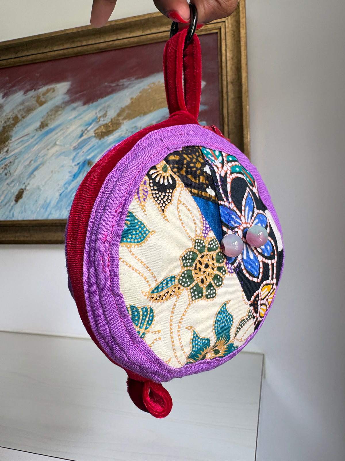 Round bag charm handmade in Singapore from a mix of Batik and Japanese fabrics. Batik bag charm. Batik bag accessory.