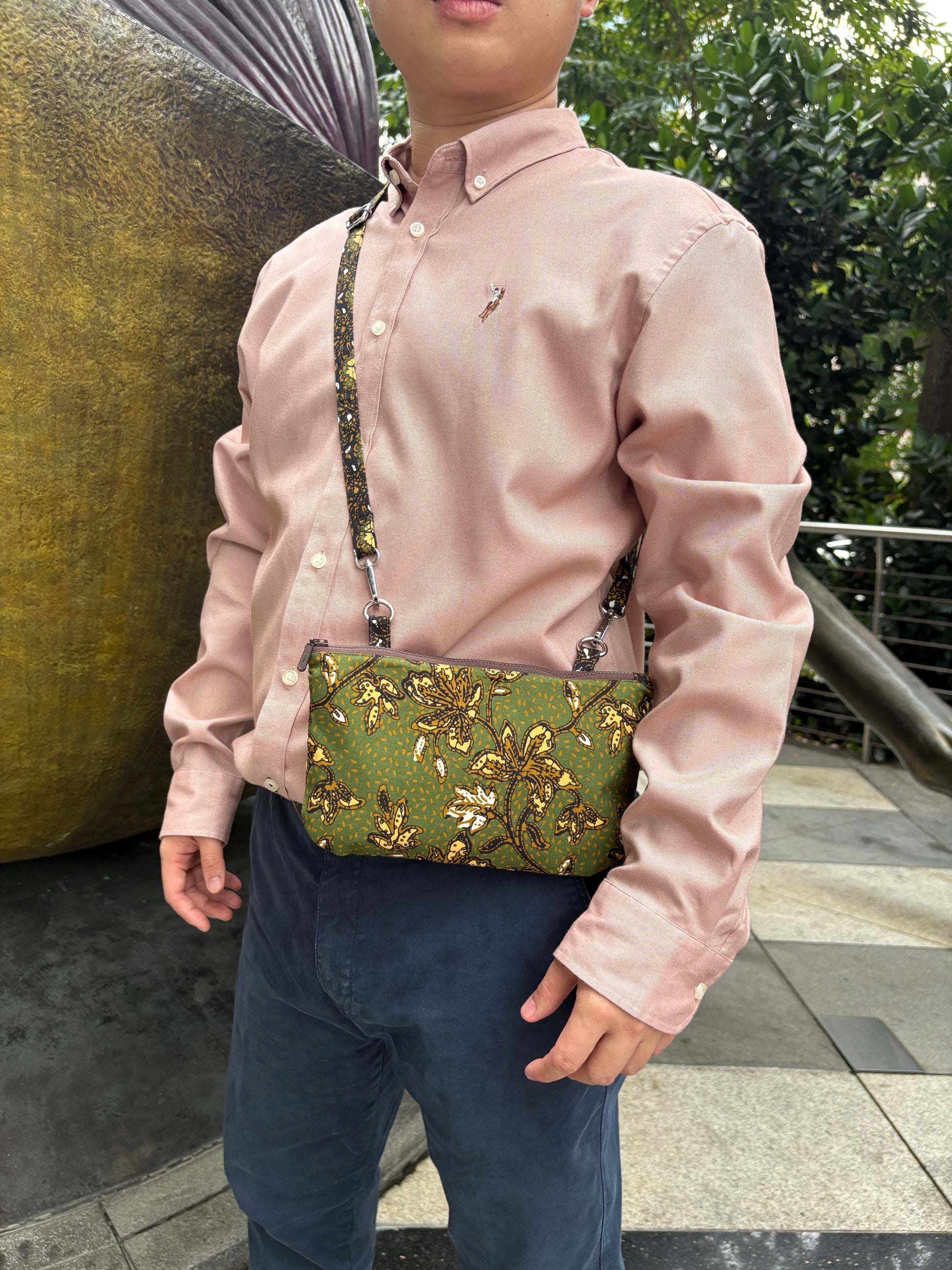 Green Batik crossbody bag with adjustable Batik strap and YKK zipper, handcrafted in Singapore.