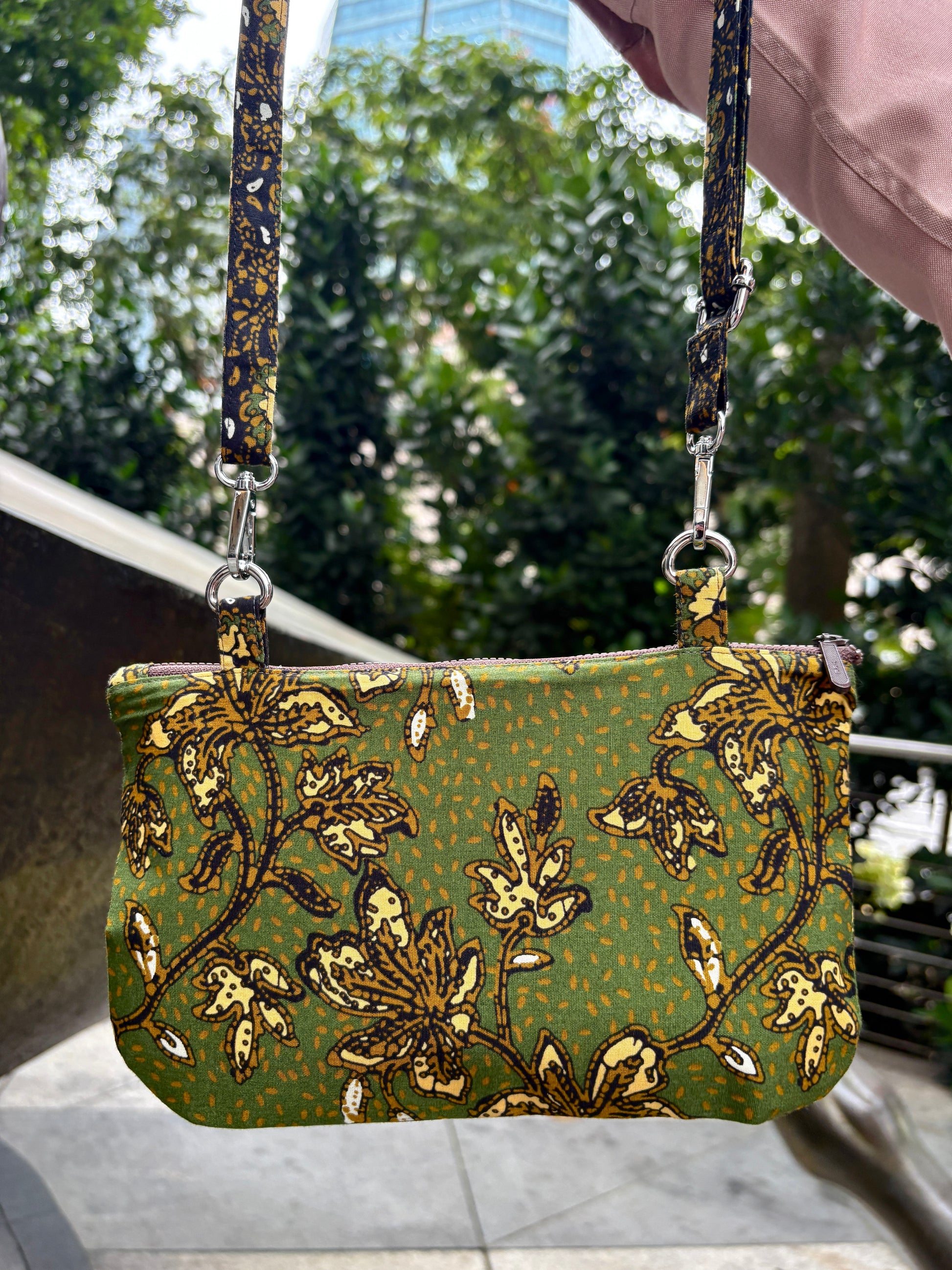 Green Batik crossbody bag with adjustable Batik strap and YKK zipper, handcrafted in Singapore.
