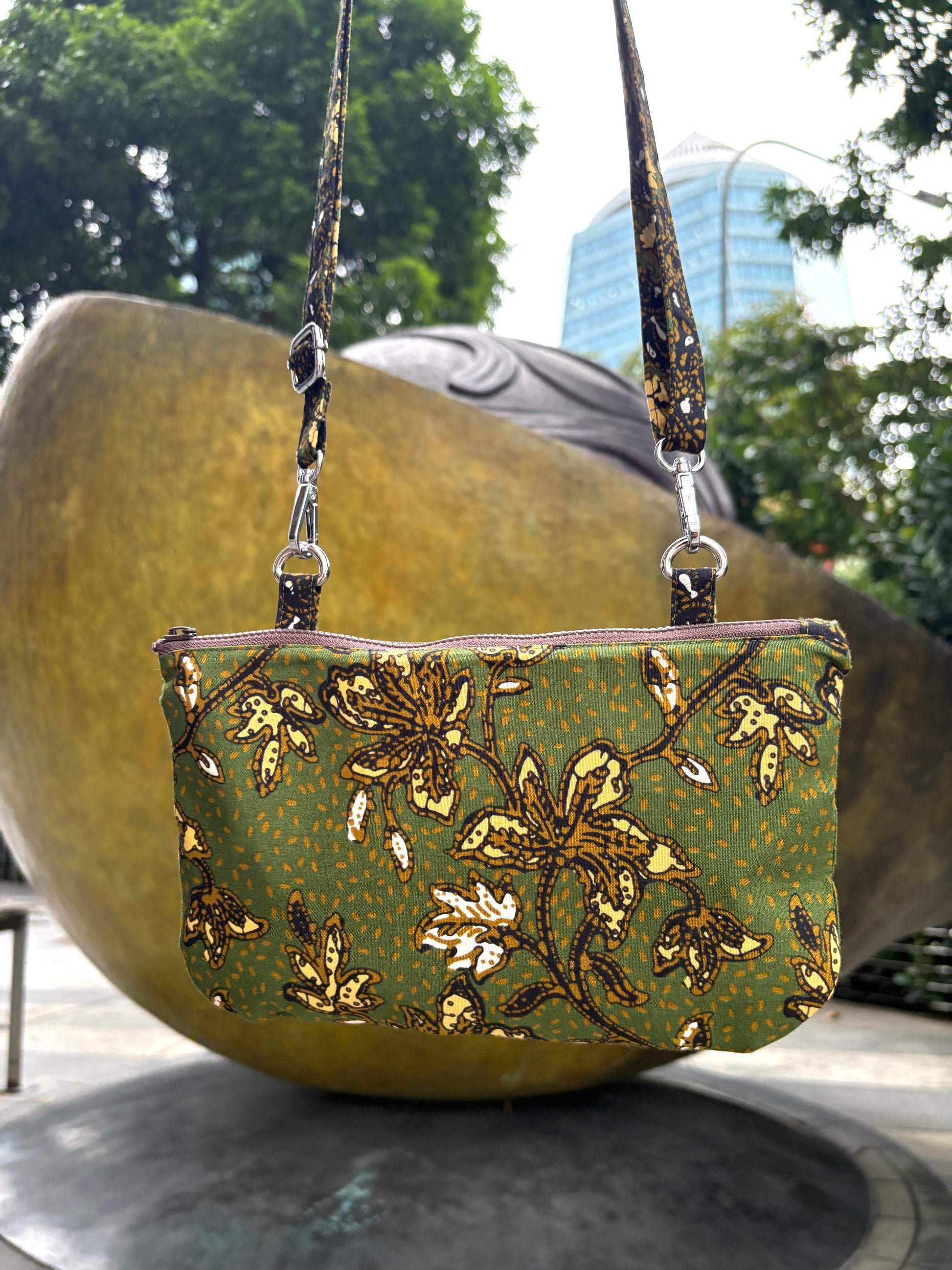 Green Batik crossbody bag with adjustable Batik strap and YKK zipper, handcrafted in Singapore.