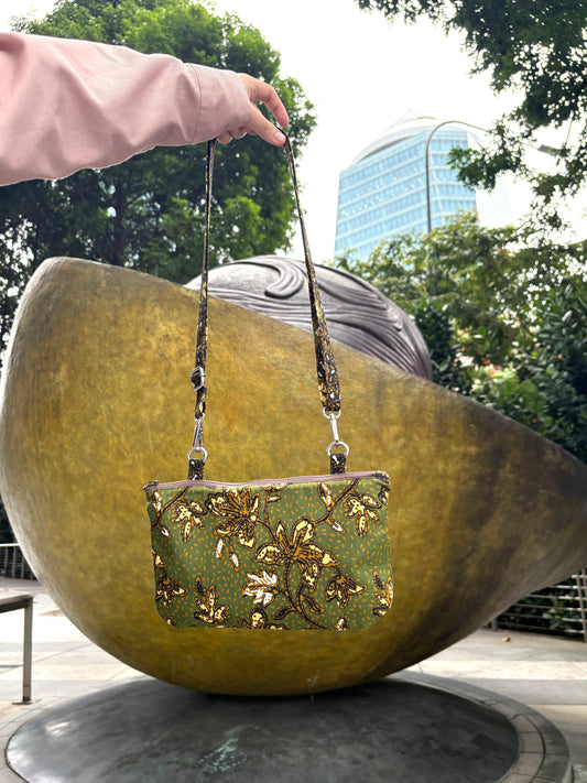 Green Batik crossbody bag with adjustable Batik strap and YKK zipper, handcrafted in Singapore.