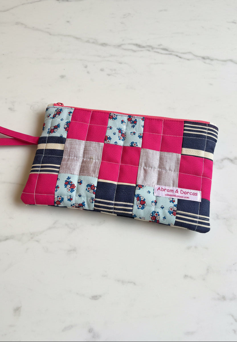 Handcrafted clutch featuring silk, Liberty of London, Japanese denim and canvas fabric, made in Singapore.
