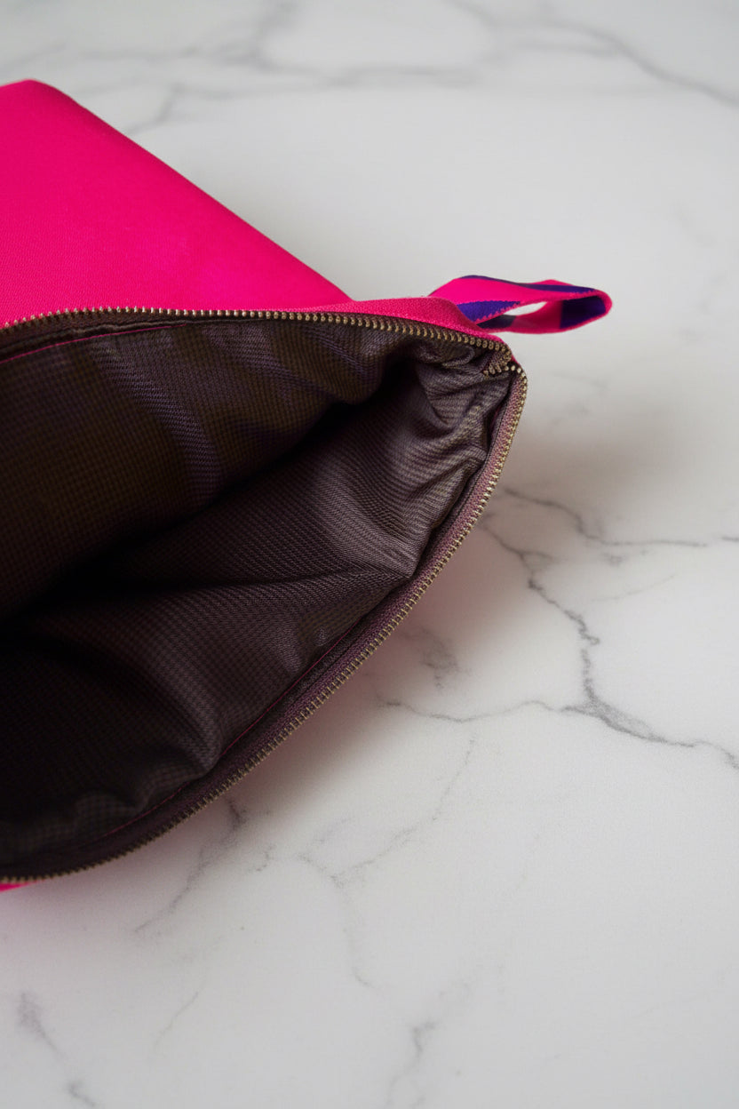 Bright pink laptop sleeve made from Japanese canvas, can fit 13 or 14 inch laptops, handmade in Singapore.