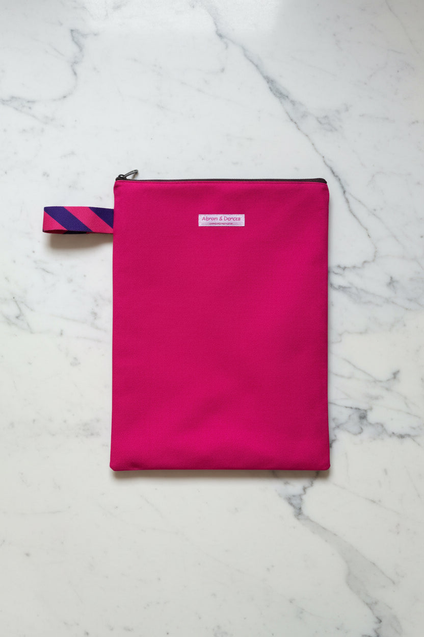 Bright pink laptop sleeve made from Japanese canvas, can fit 13 or 14 inch laptops, handmade in Singapore.