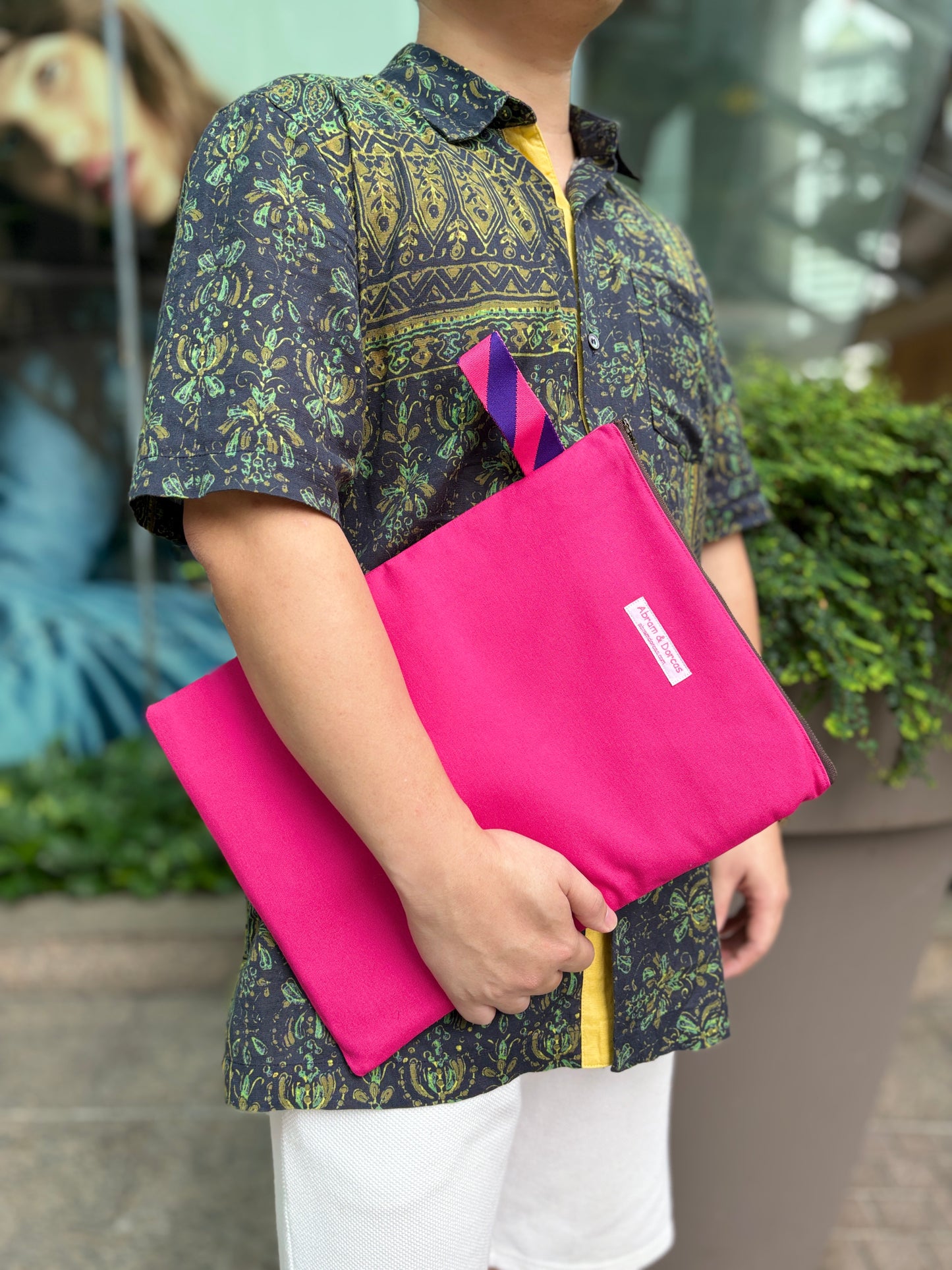 Bright pink laptop sleeve made from Japanese canvas, can fit 13 or 14 inch laptops, handmade in Singapore.