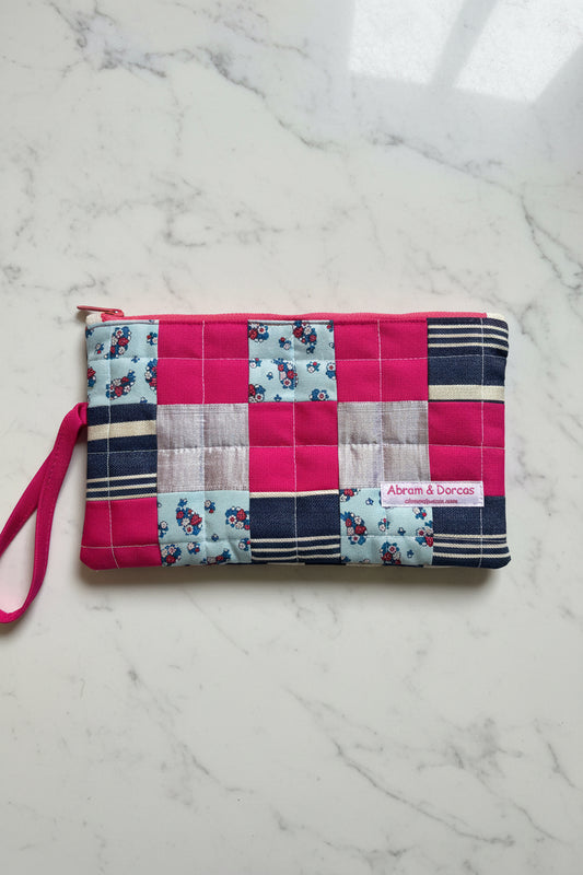 Handcrafted clutch featuring silk, Liberty of London, Japanese denim and canvas fabric, made in Singapore.
