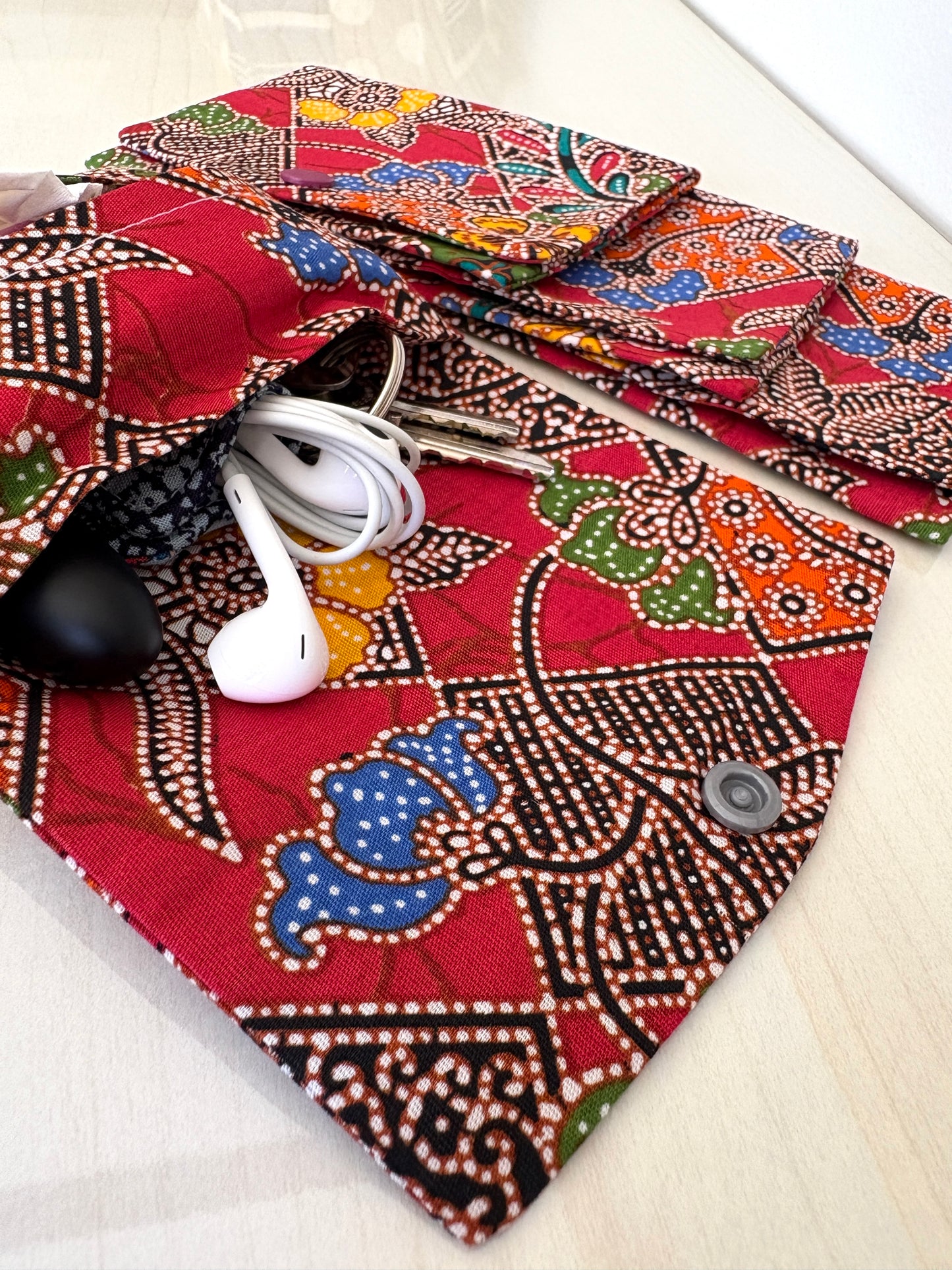 Red Batik tissue holder pouch made from cotton Batik and snap closure, handmade in Singapore.