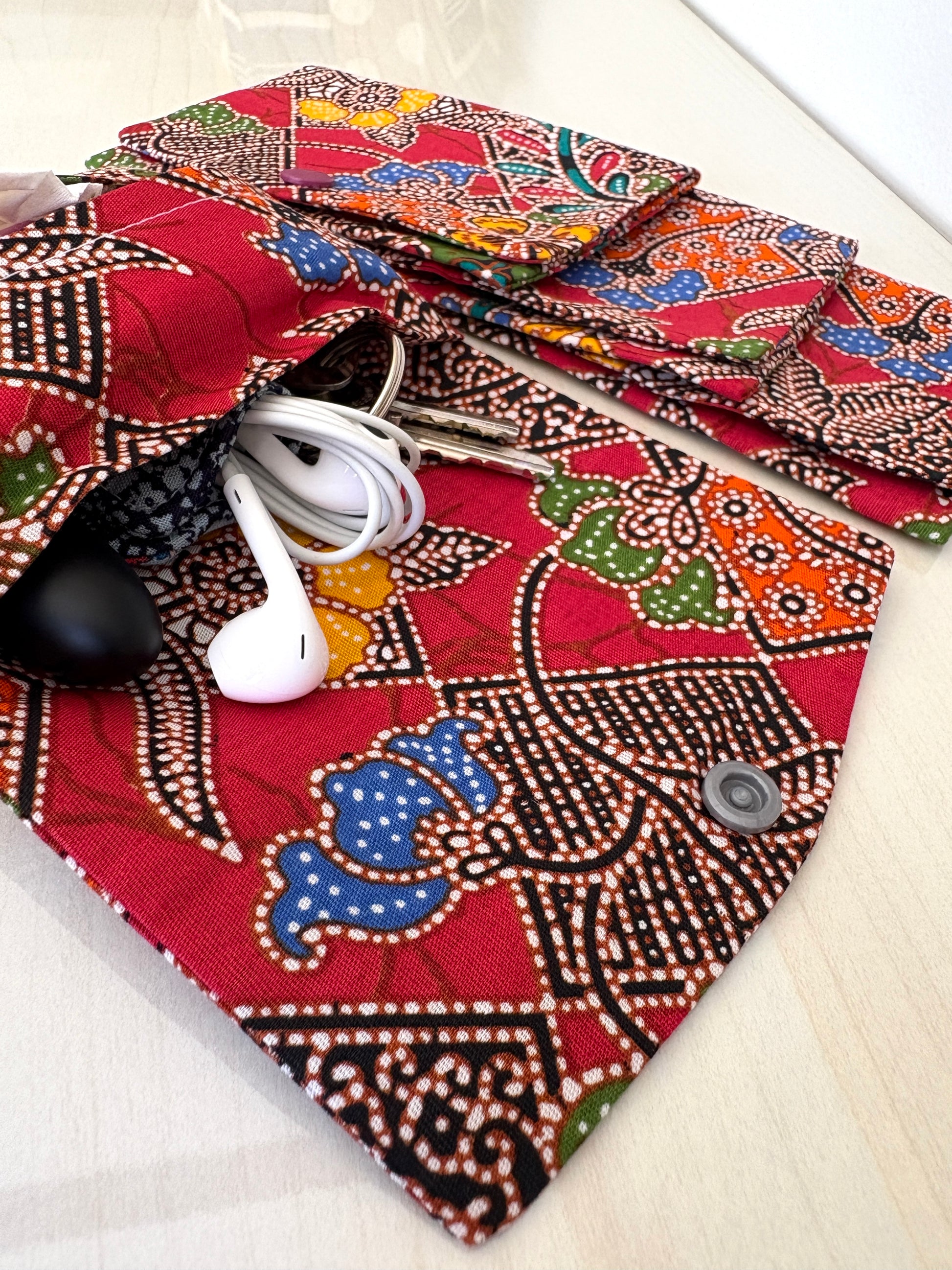 Red Batik tissue holder pouch made from cotton Batik and snap closure, handmade in Singapore.