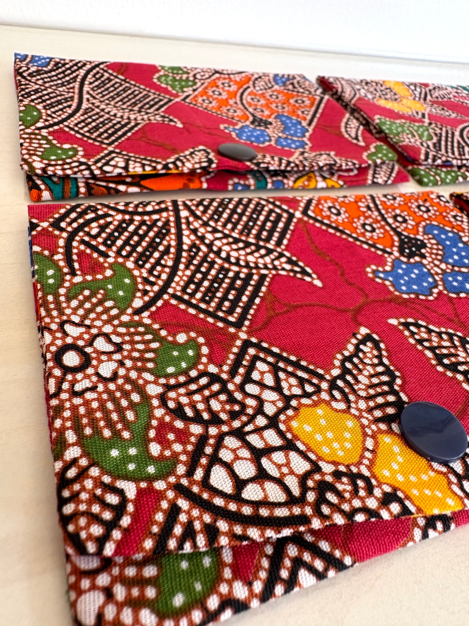 Red Batik tissue holder pouch made from cotton Batik and snap closure, handmade in Singapore.