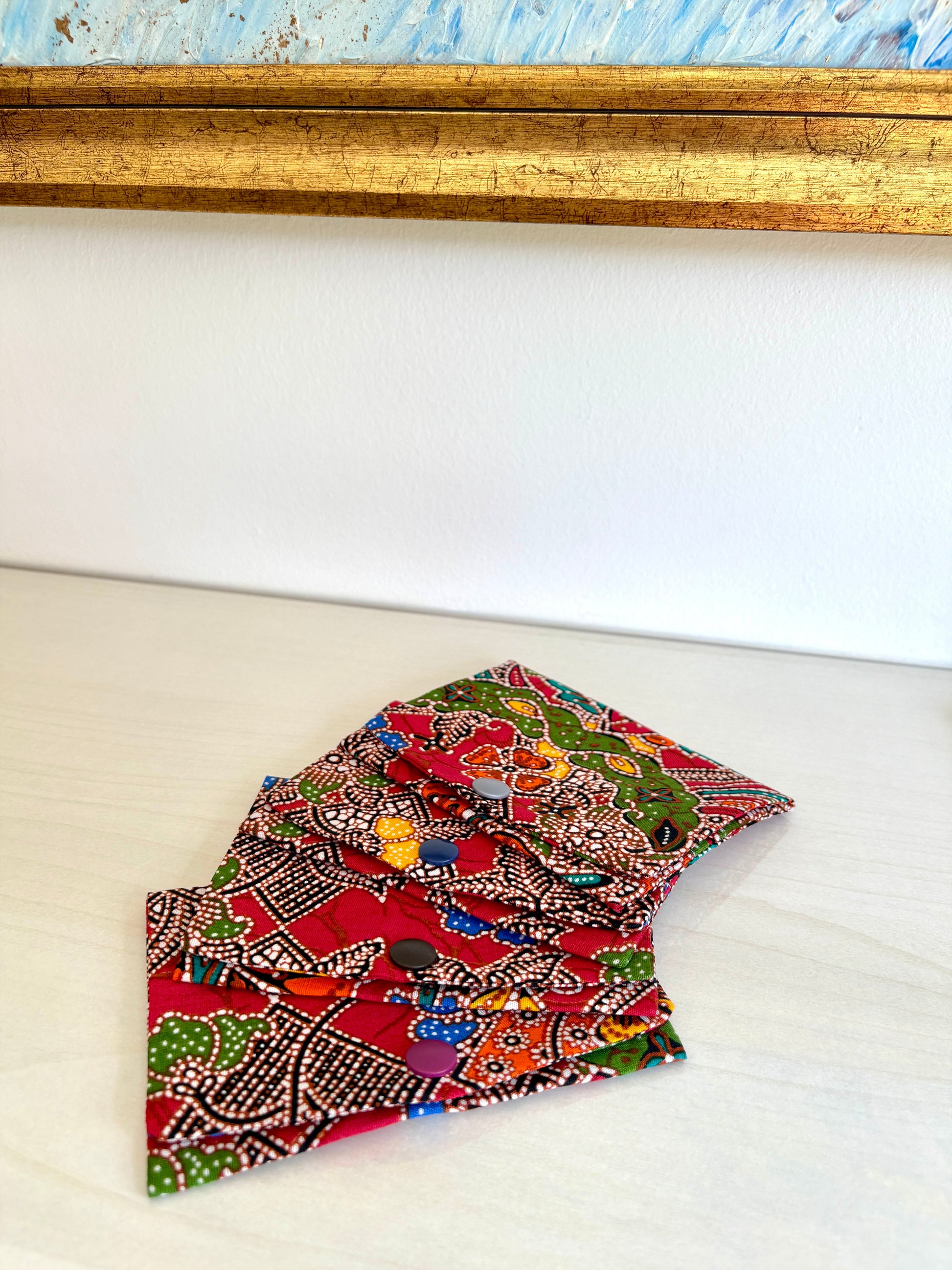 Red Batik tissue holder pouch made from cotton Batik and snap closure, handmade in Singapore.