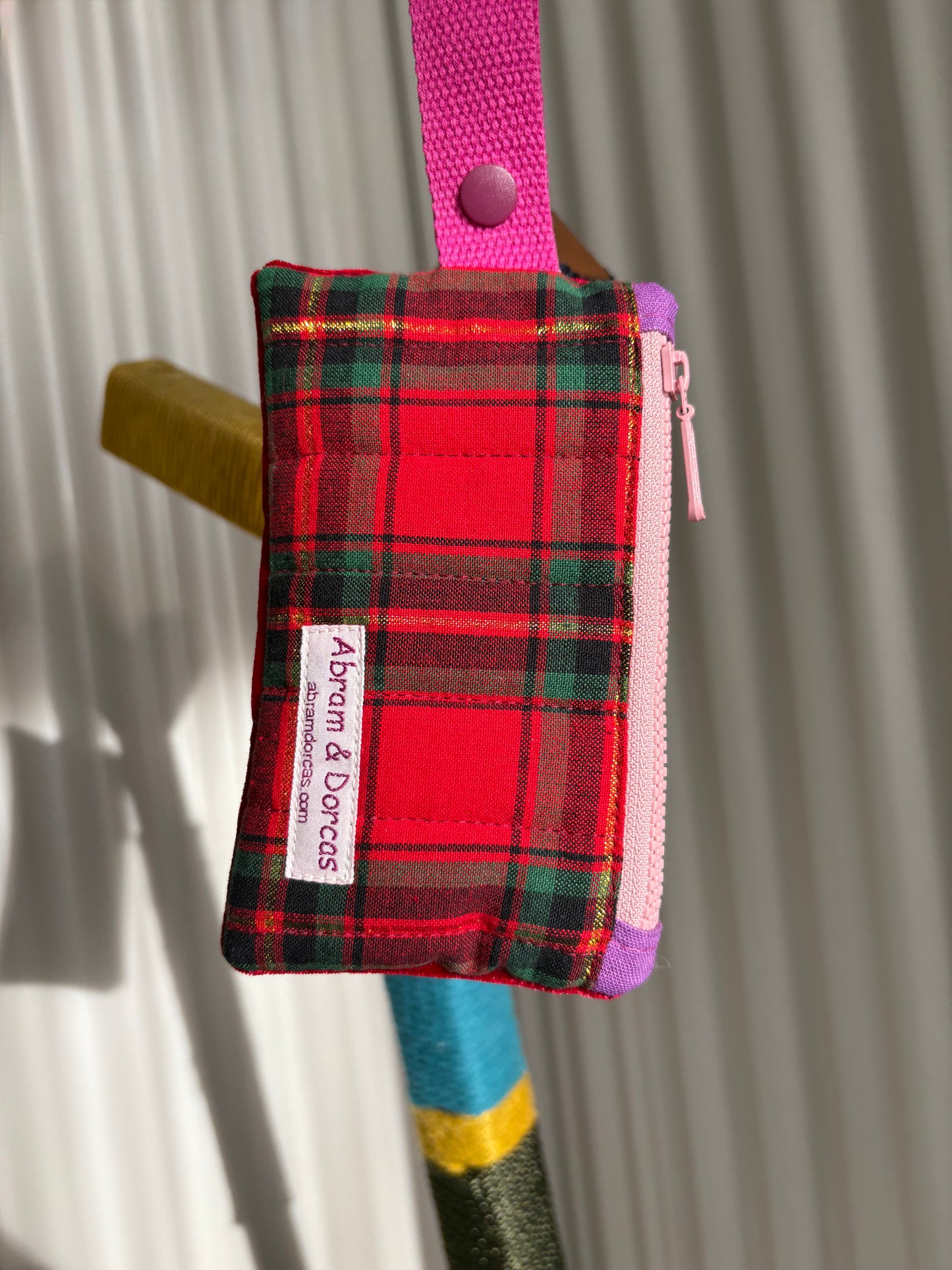 Red tartan and velvet YKK zipper pouch with pink strap handmade in Singapore.