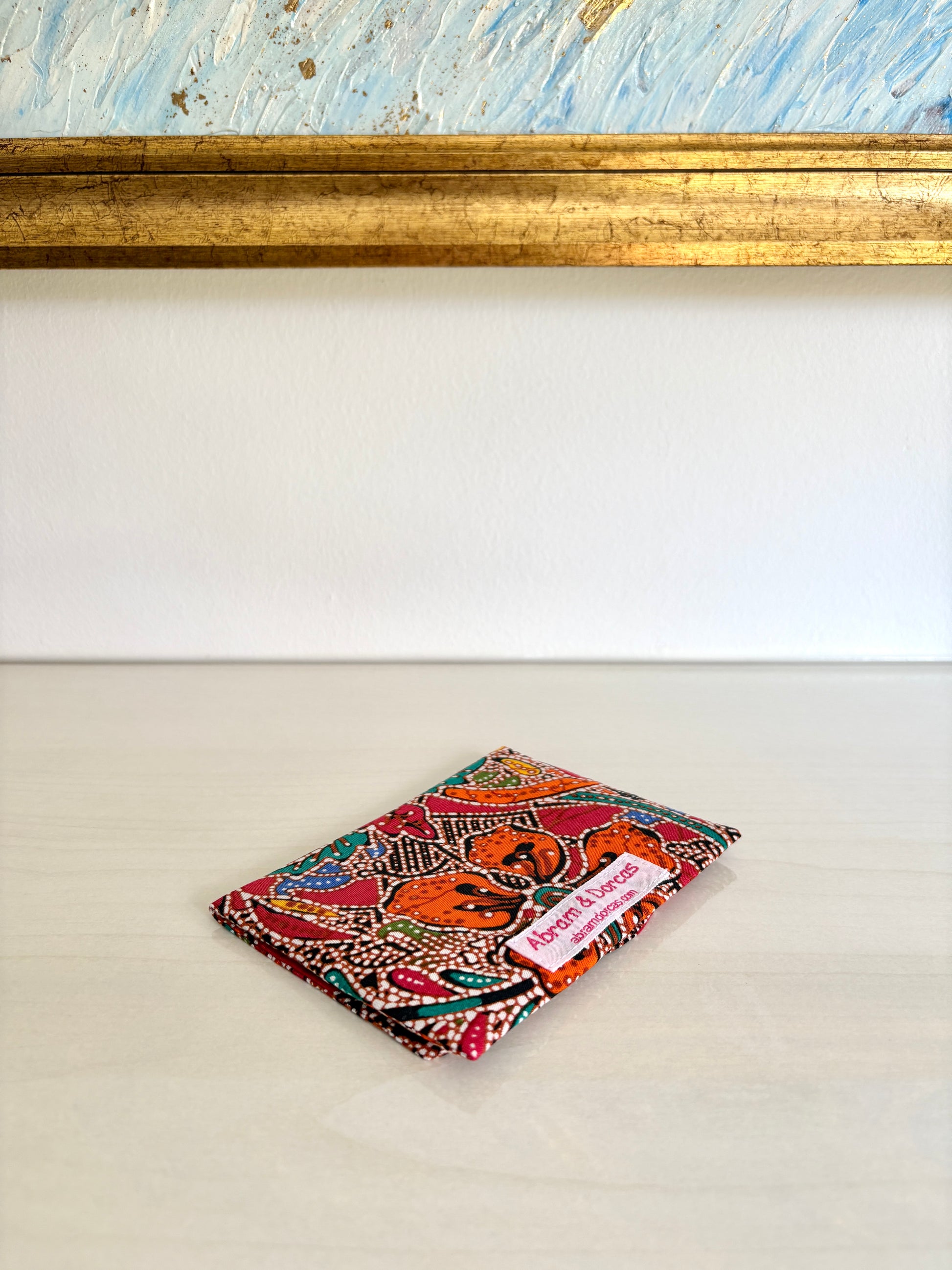Red Batik tissue holder pouch made from cotton Batik and snap closure, handmade in Singapore.