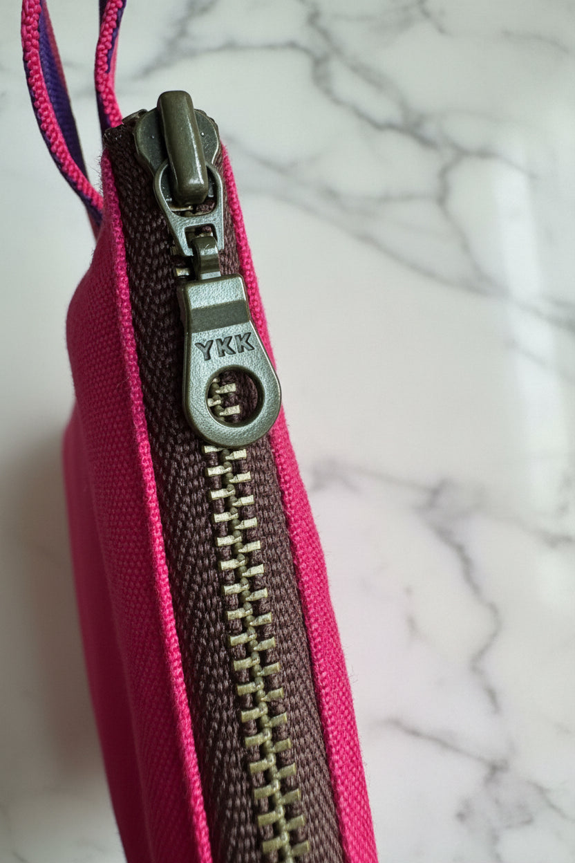 Bright pink laptop sleeve made from Japanese canvas, can fit 13 or 14 inch laptops, handmade in Singapore.